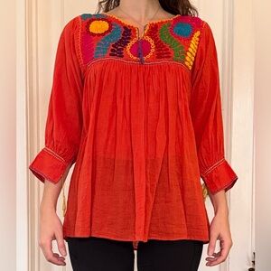 Embroidered red orange top